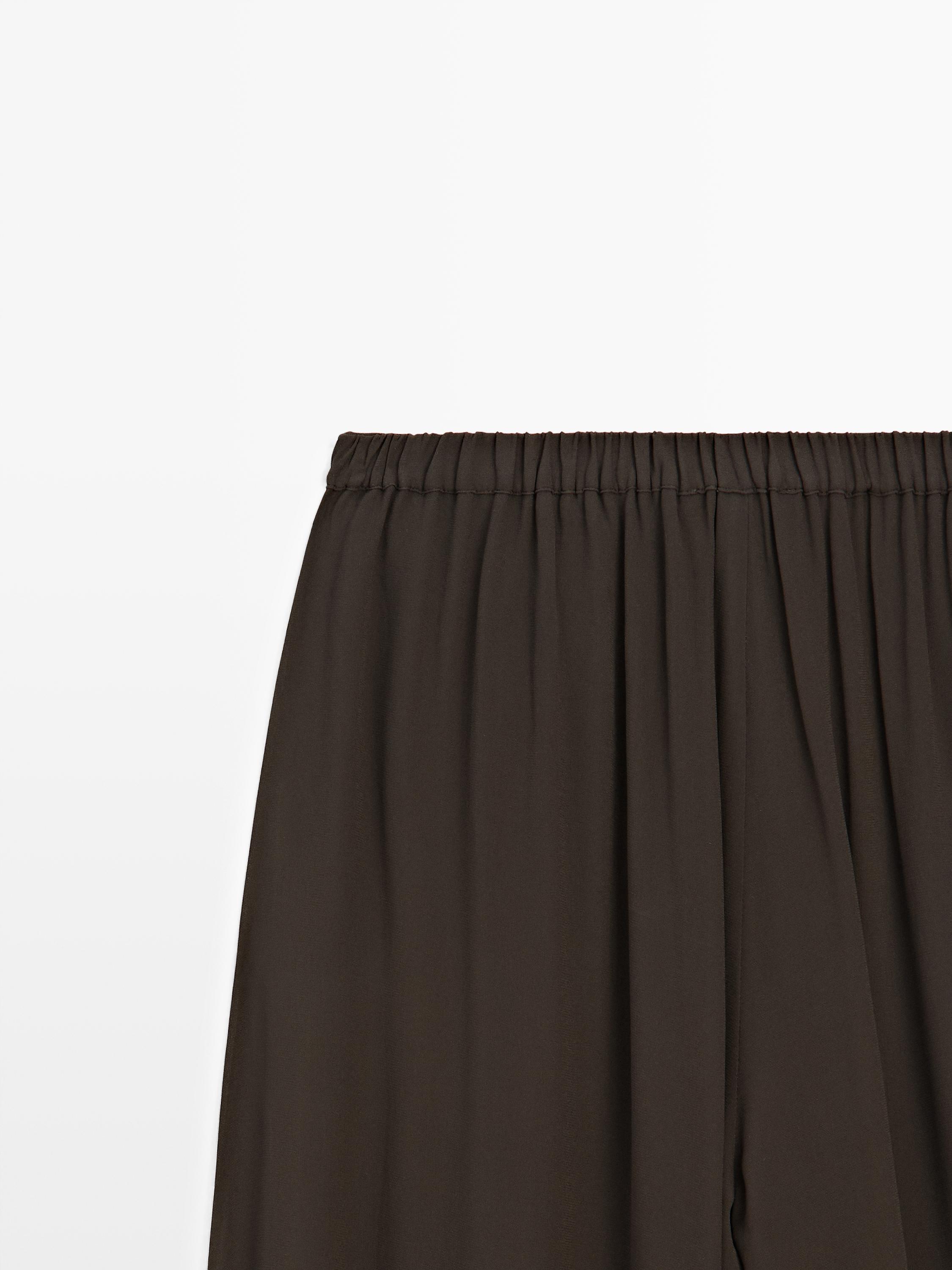 Pantalon bouffant semi-transparent avec boutons